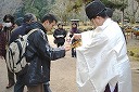 The drink offering from the Shinto priest.